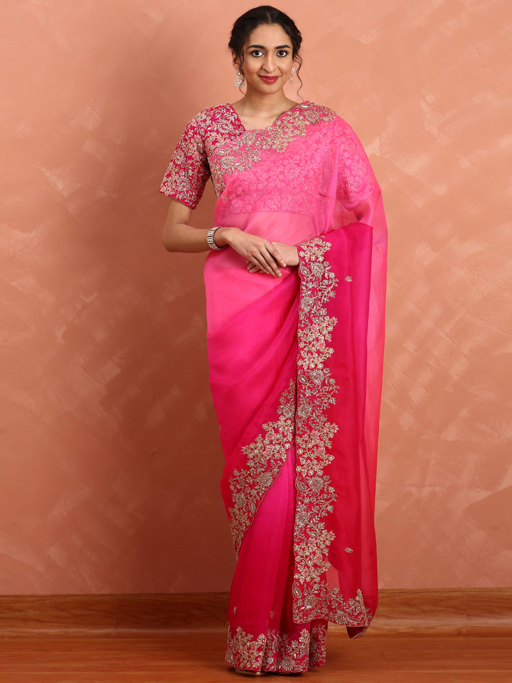 Rani pink pure organza saree with heavy blouse with pearl and cut dana embroidery