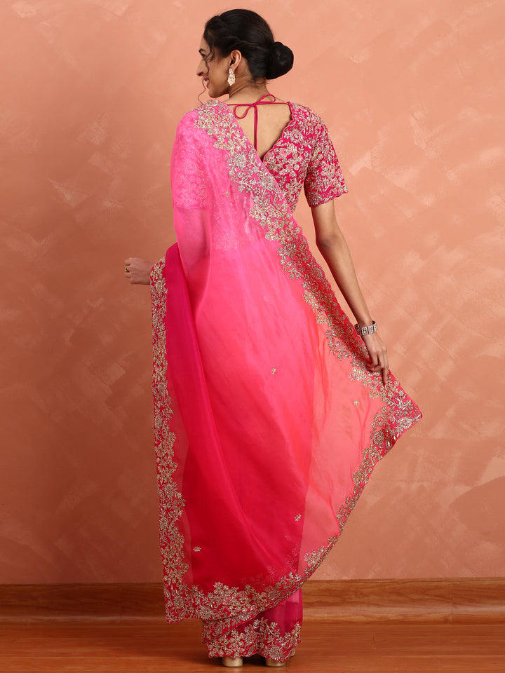 Rani pink pure organza saree with heavy blouse with pearl and cut dana embroidery