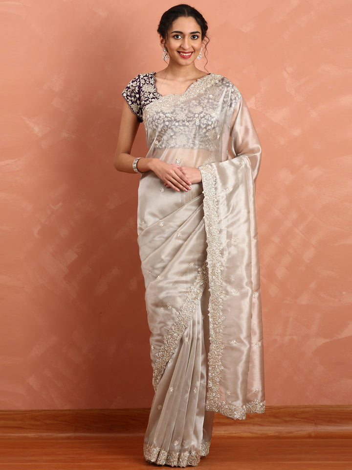 Silver tissue saree with Zari embroidery and contrast blouse