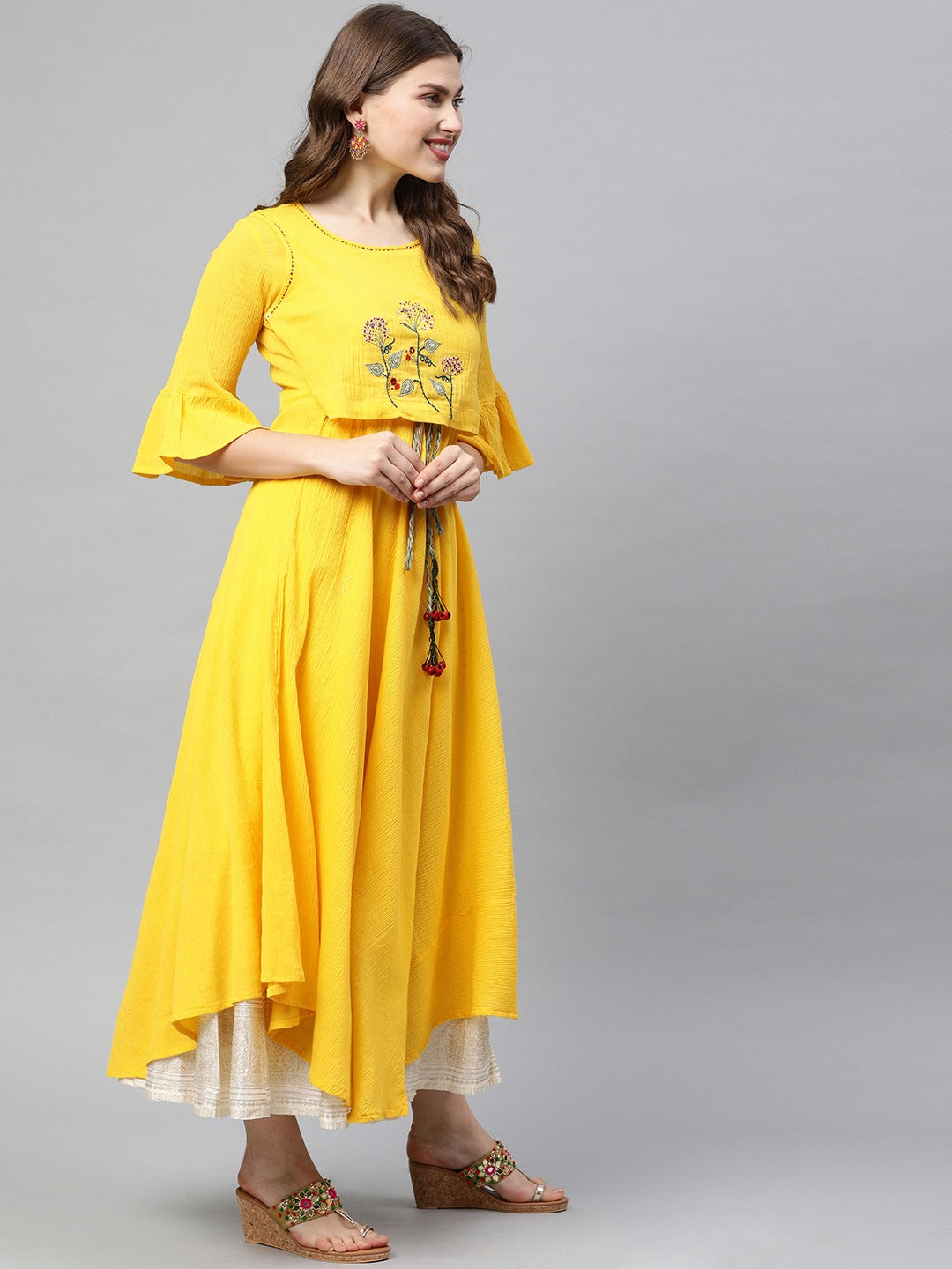 Neerus Yellow embroidered A-line asymmetric layered kurti - front view