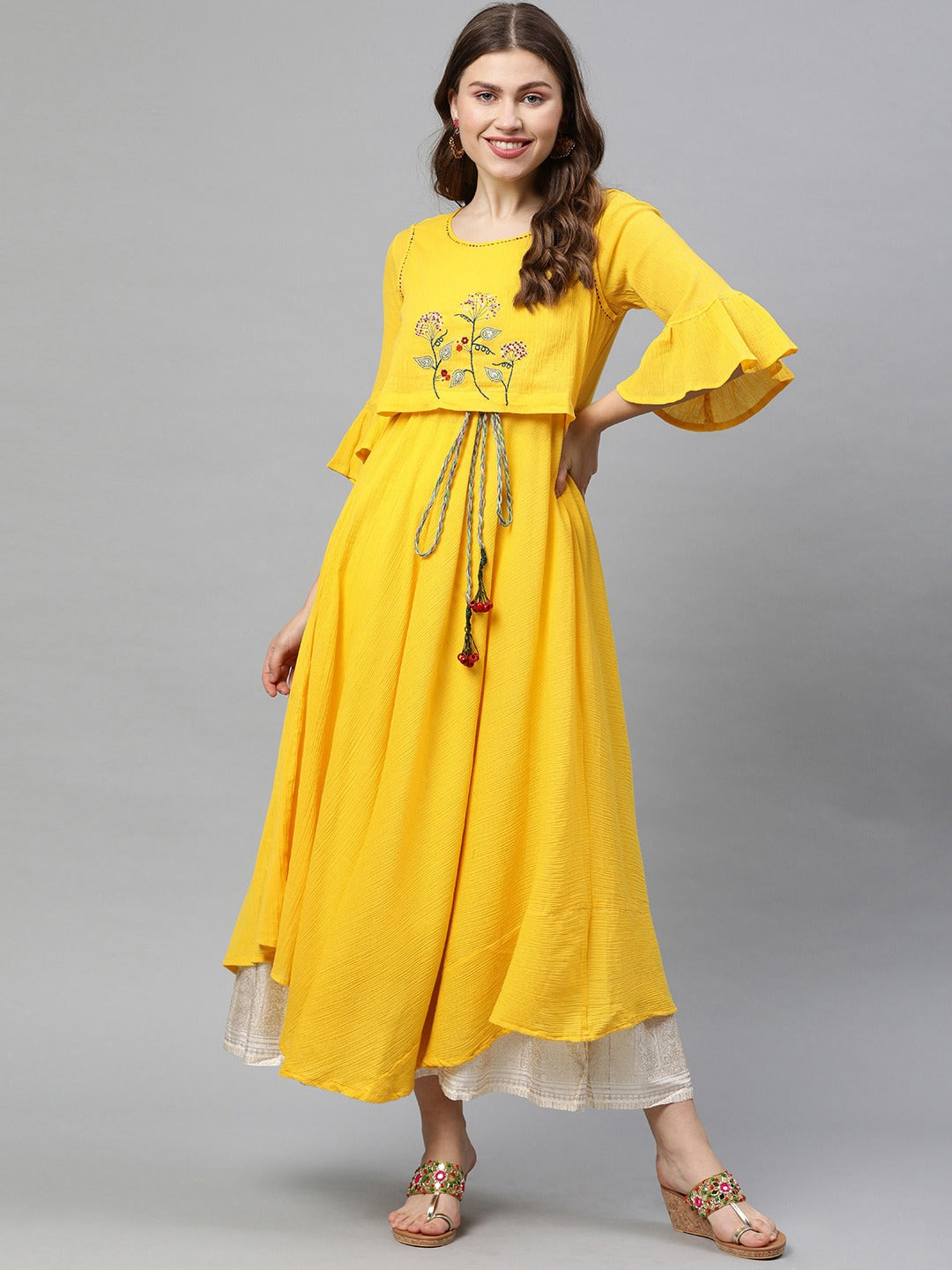 Neerus Yellow embroidered A-line asymmetric layered kurti - back view