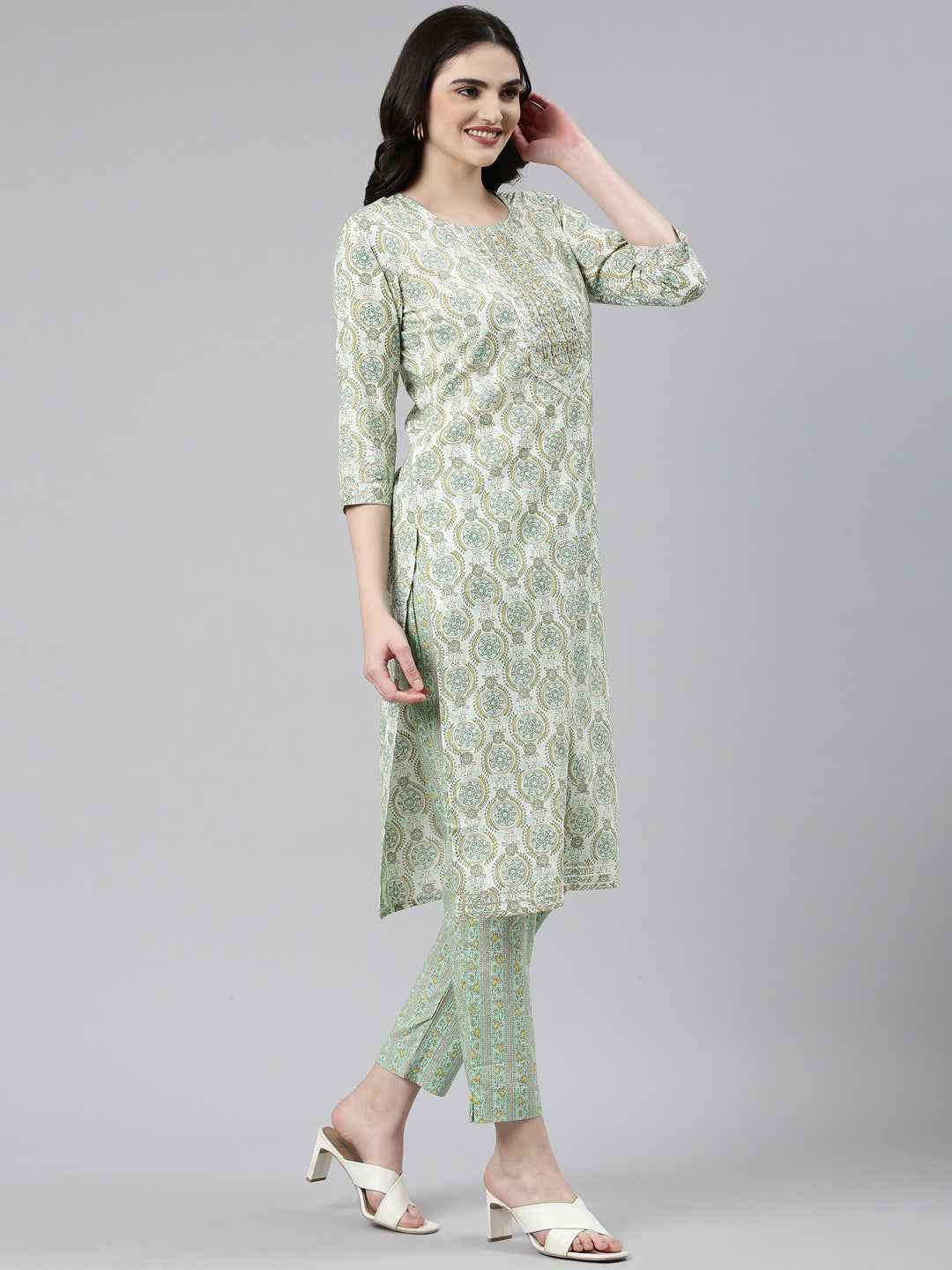 Neerus Green cotton printed kurta set with trouser and dupatta - back view