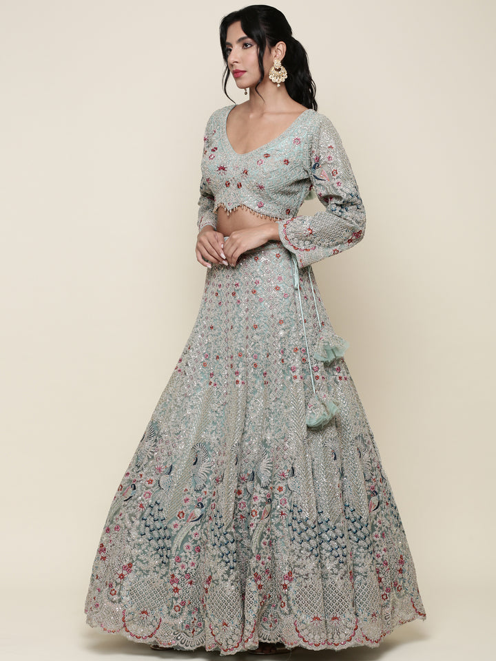 Sea green net heavy embroidered Three piece ghagra set