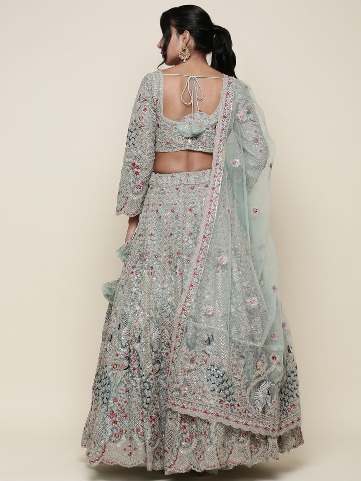 Sea green net heavy embroidered Three piece ghagra set