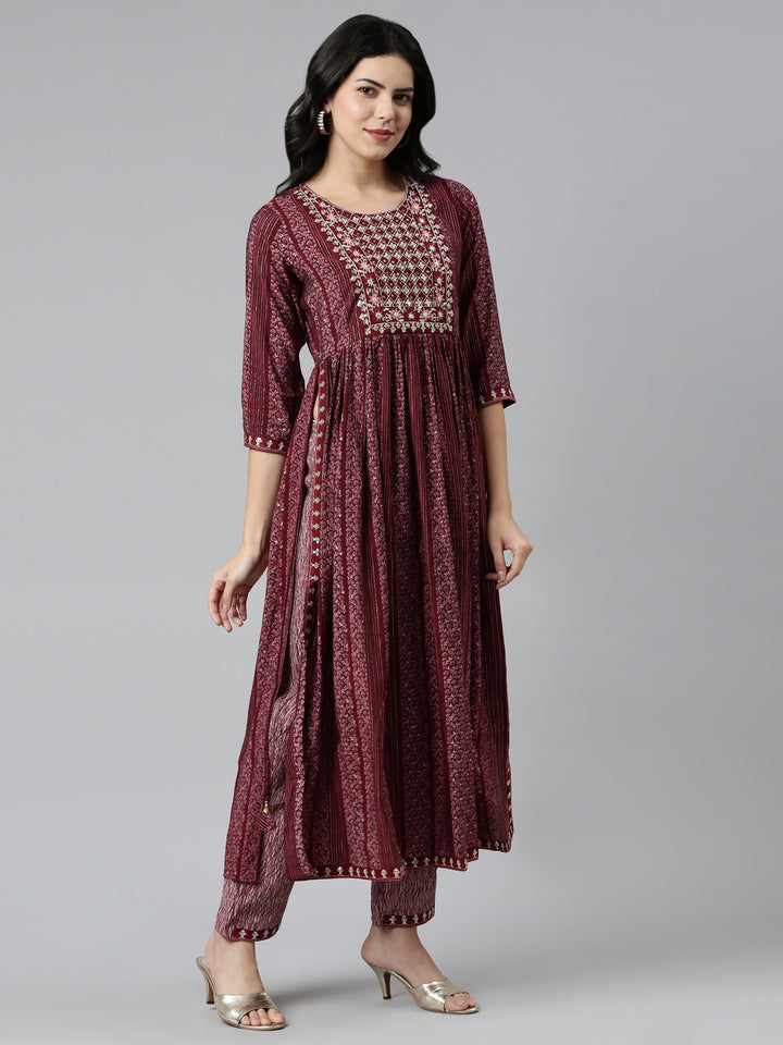 Neerus Maroon printed Nyra cut kurta set - back view