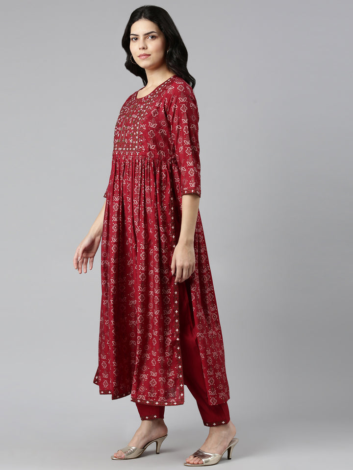 Neerus Maroon printed Nyra cut kurta set - back view