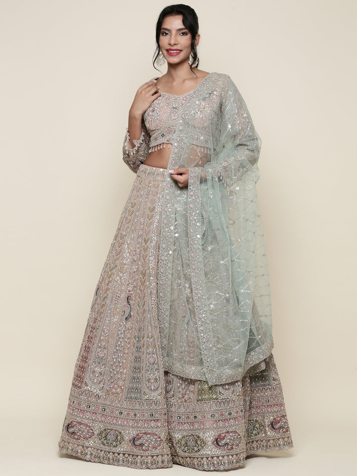Beige net heavy embroidered three piece ghagra set