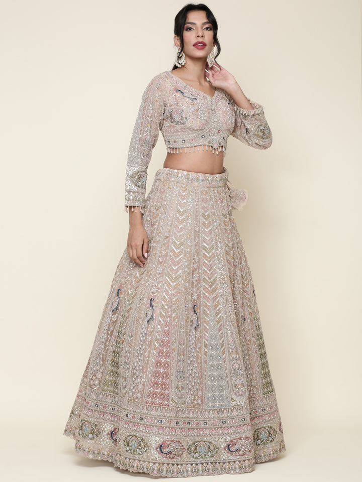 Beige net heavy embroidered three piece ghagra set
