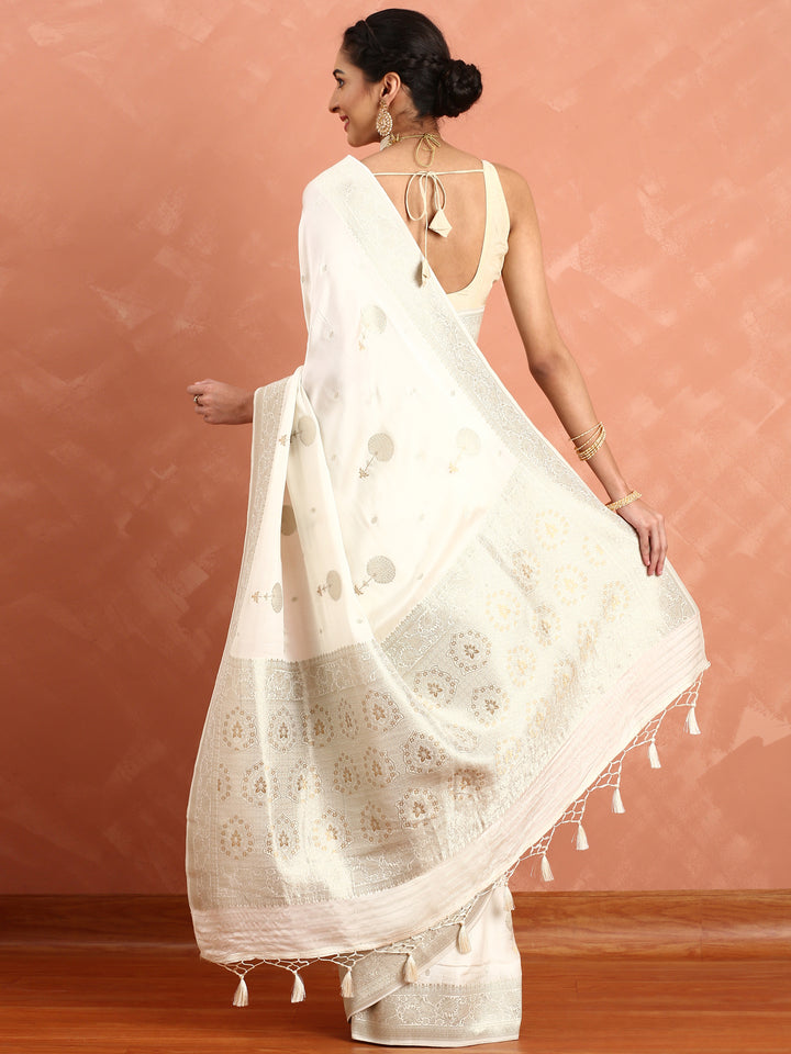 White Banaras silk saree with zari motifs and border