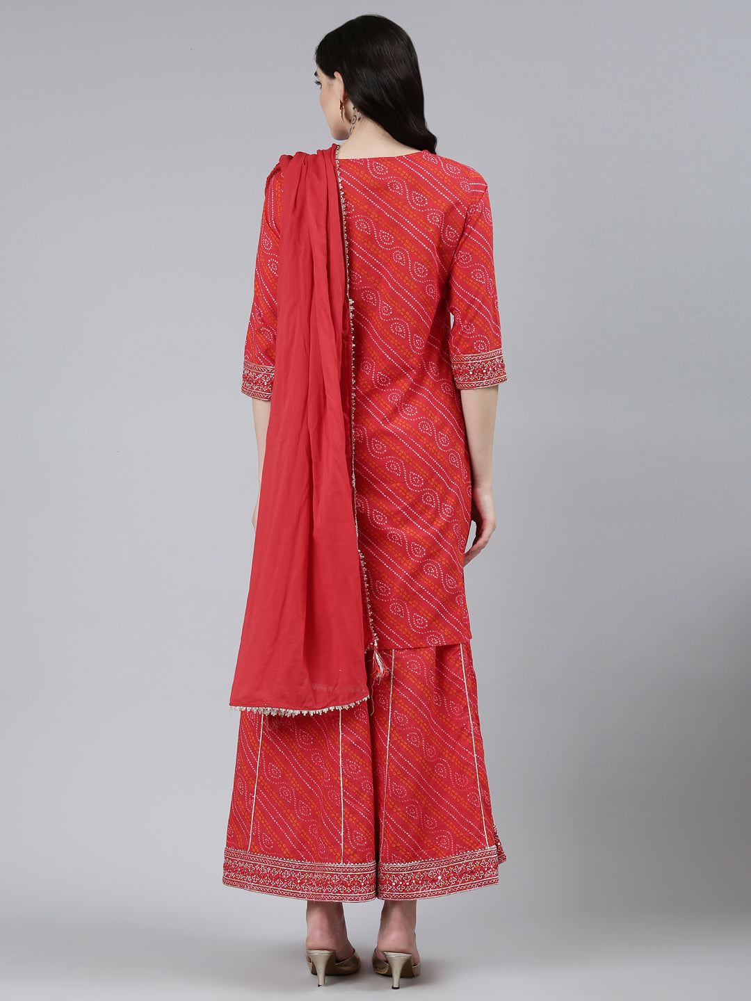 Neerus Red Bandhani printed kurta set with palazzo and dupatta - side view