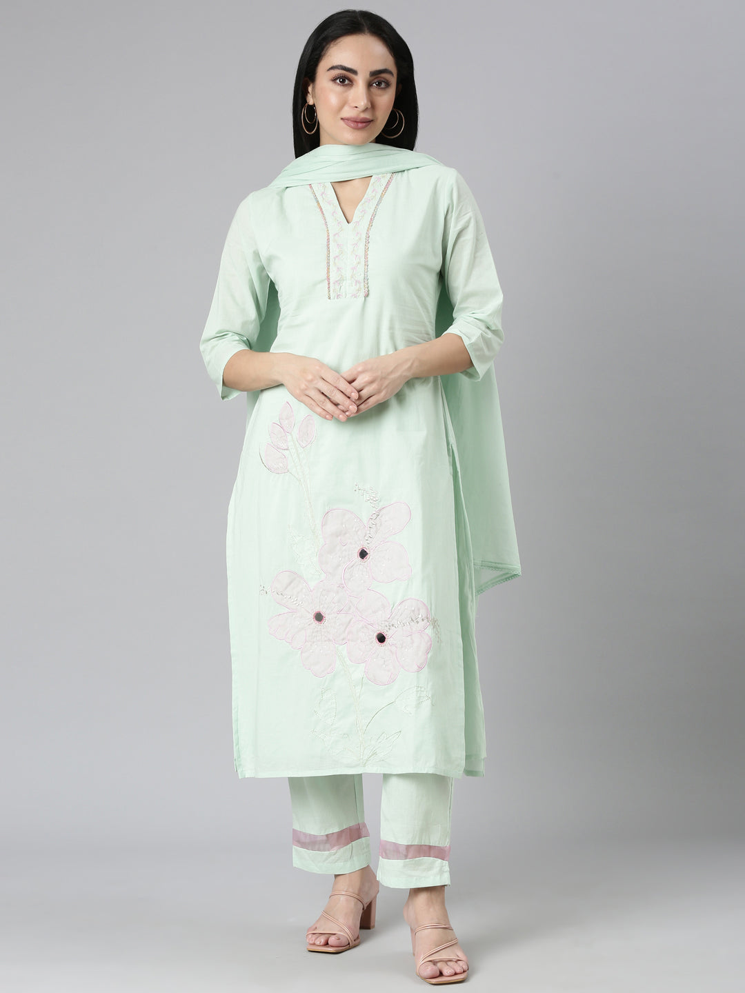 Neerus Green solid straight kurta suit set with trouser and dupatta - front view