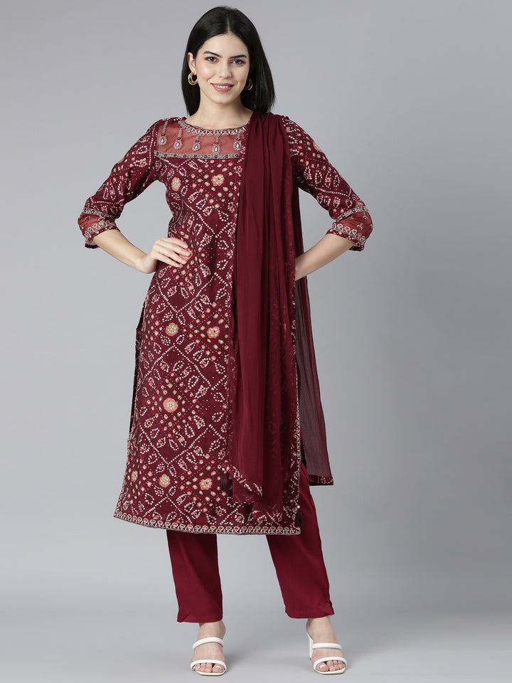 Neerus Maroon Bandhani printed kurta set with trouser and dupatta - front view