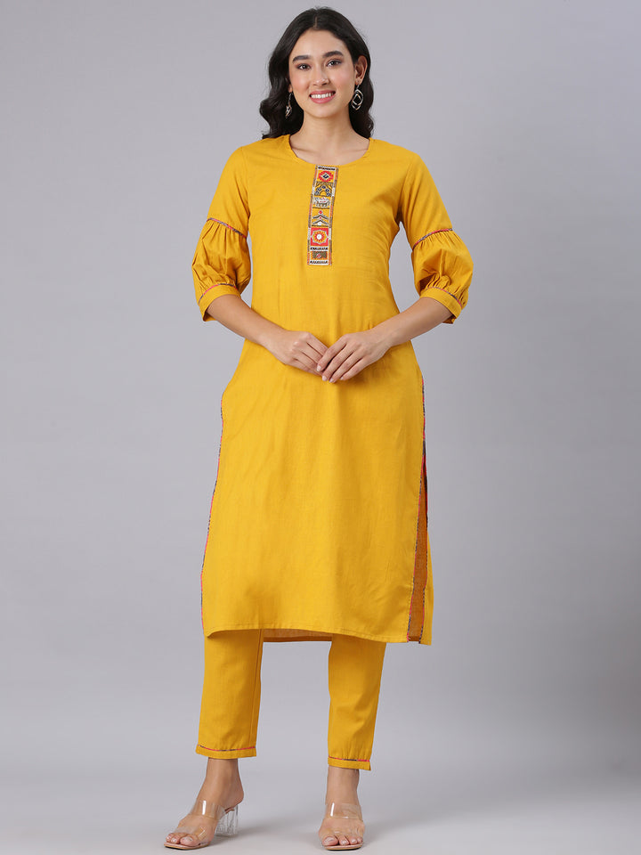 Neerus Mustard Solid Straight Kurta And Trousers