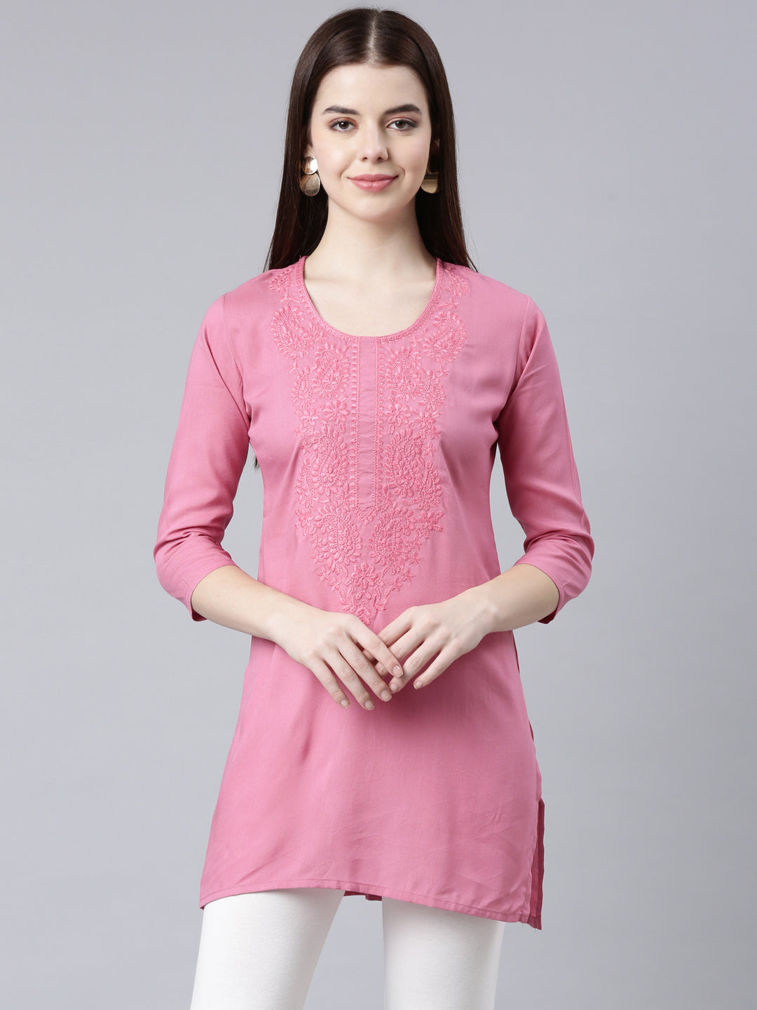 Neerus Pink rayon solid straight kurti - front view