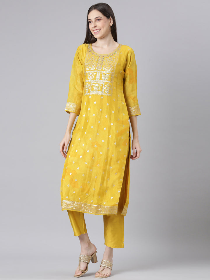 Neerus Mustard Solid Straight Kurta and Trousers With Dupatta