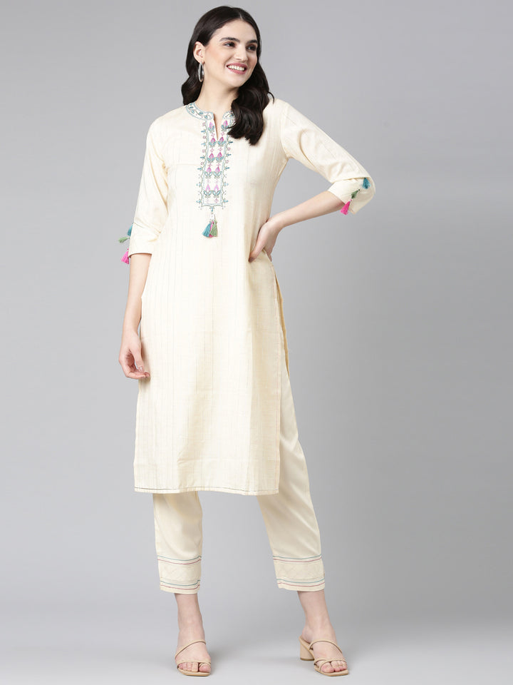 Neerus Cream Regular Straight Solid Kurta And Trousers