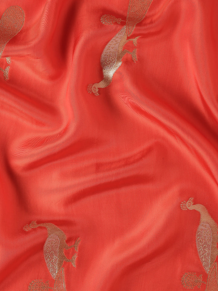 Red and gold silk saree with peacock booti pallu