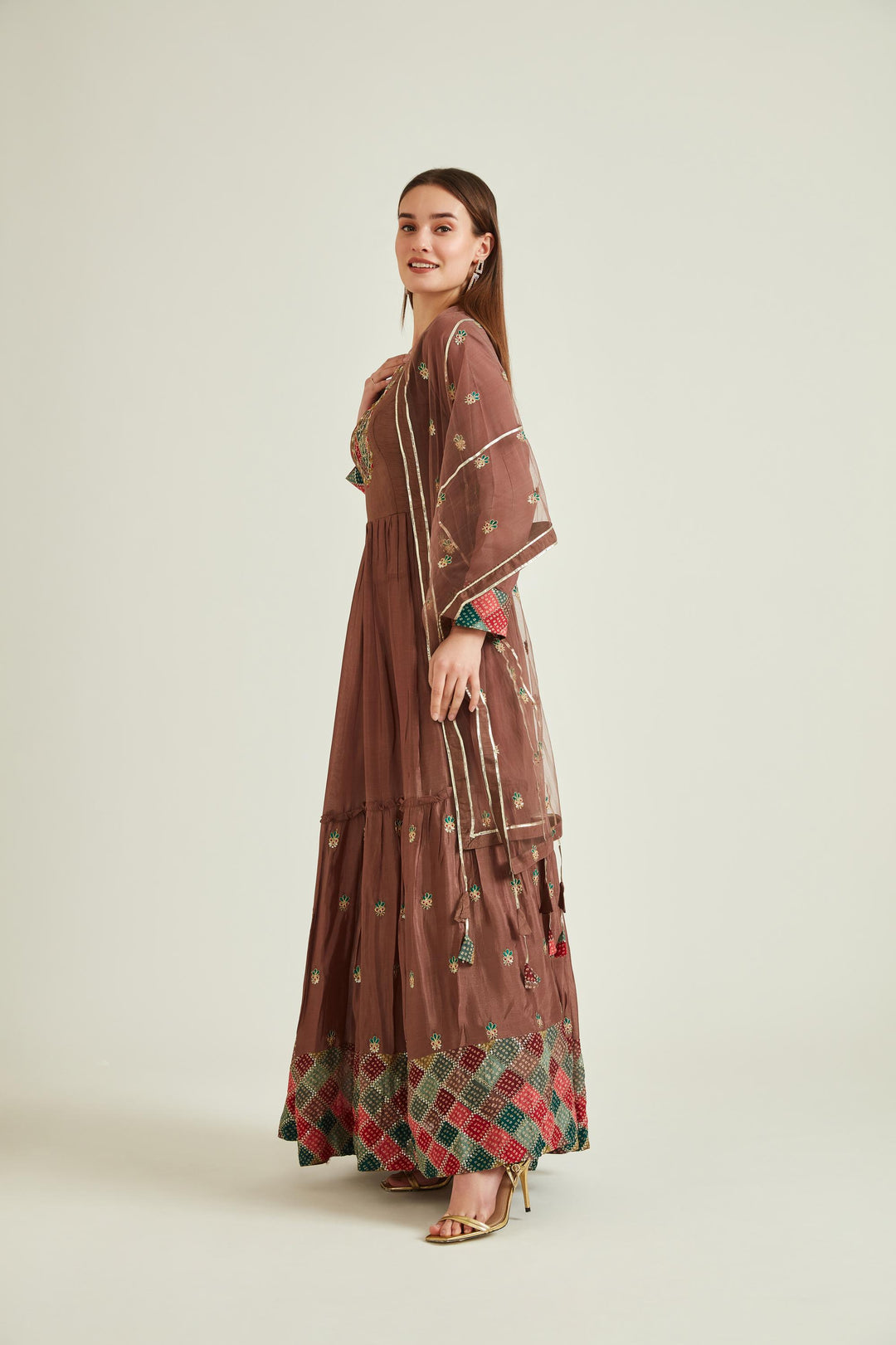 Neerus Brown silk mirror work tiered gown with net dupatta - back view