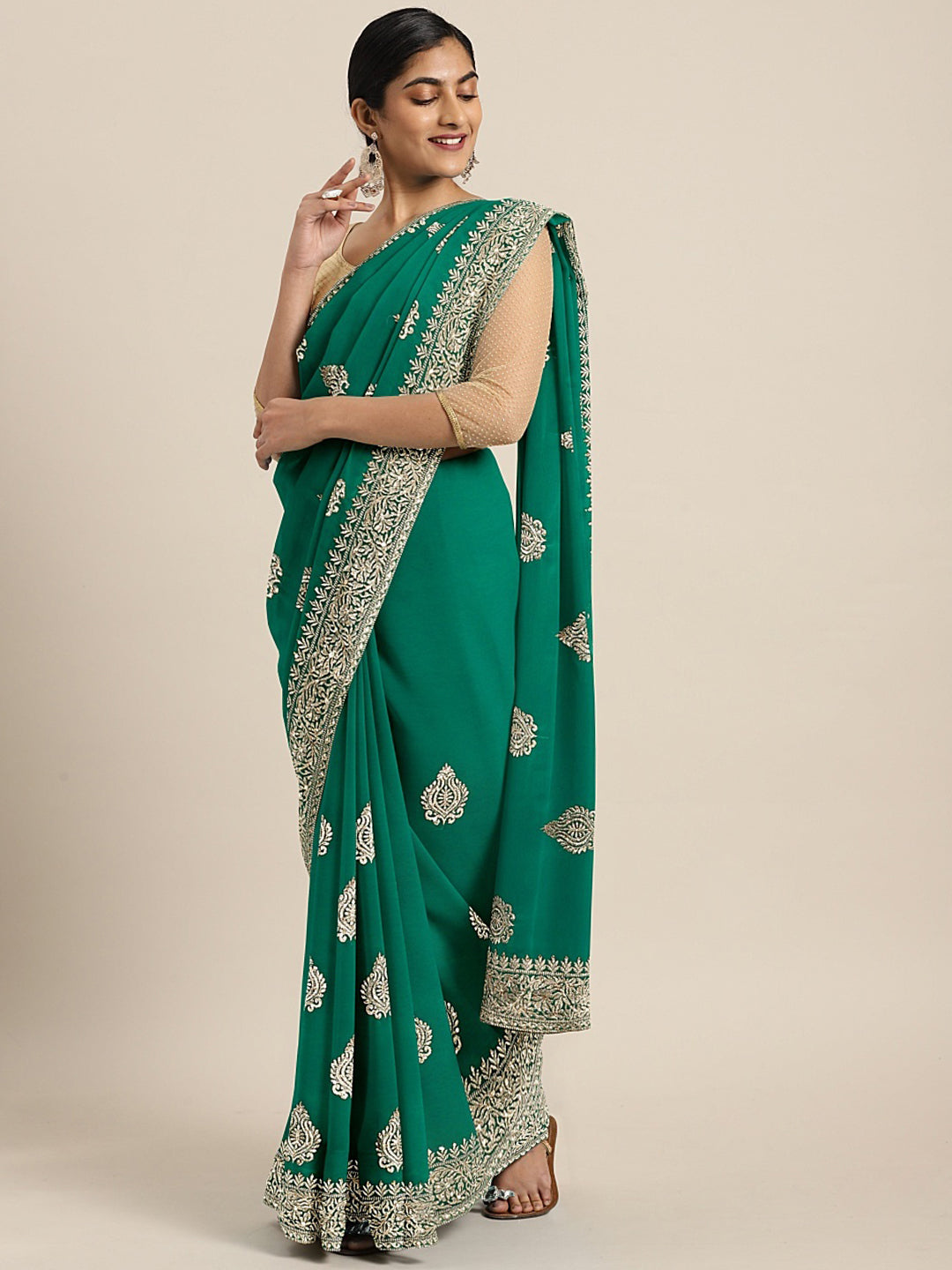Neerus Green georgette textured saree with blouse - front view