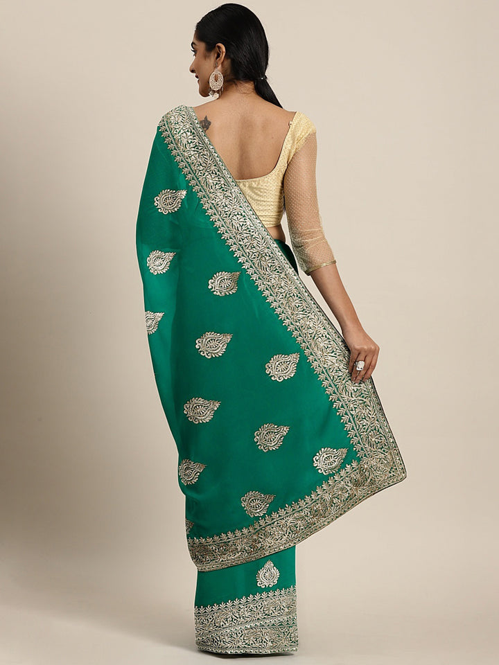 Neerus Green georgette textured saree with blouse - back view