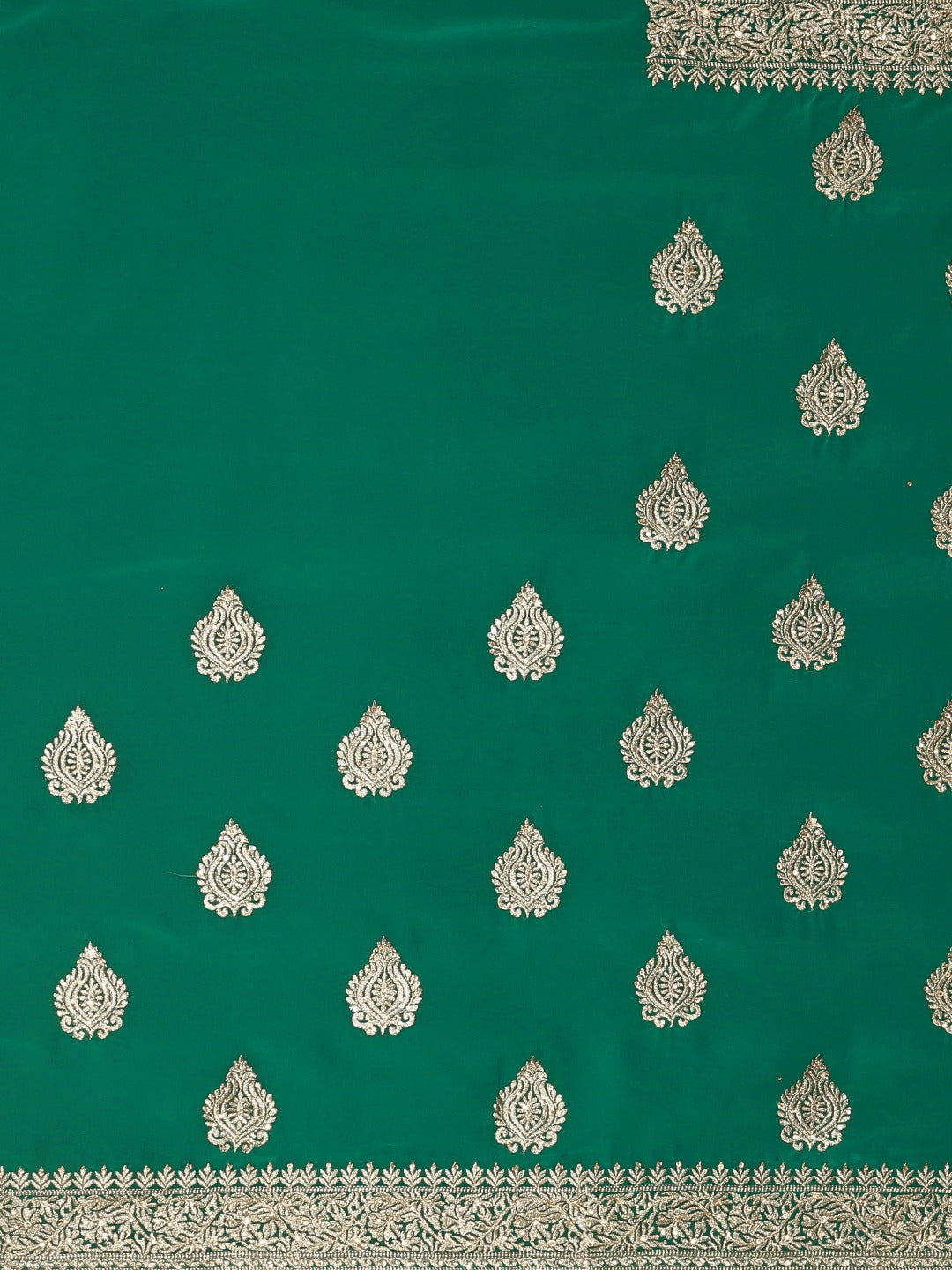 Neerus Green georgette textured saree with blouse - side view