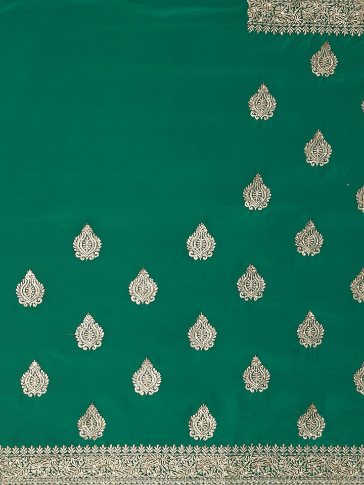 Neerus Green georgette textured saree with blouse - side view