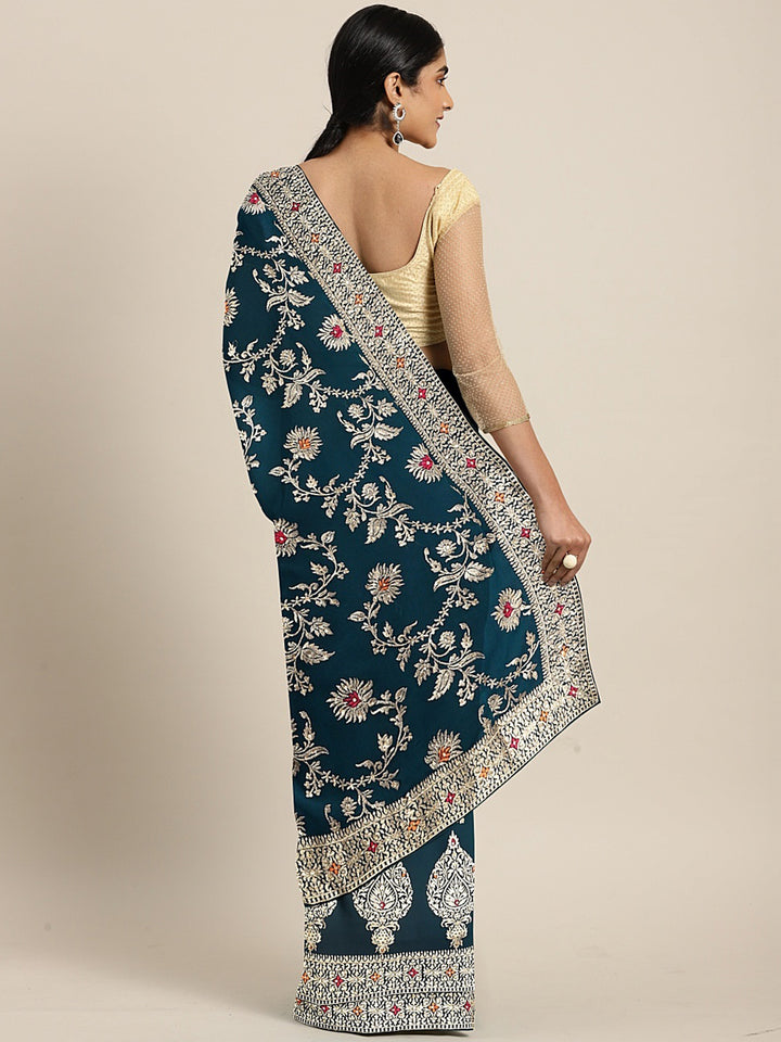 Neerus Green georgette textured saree with blouse - back view