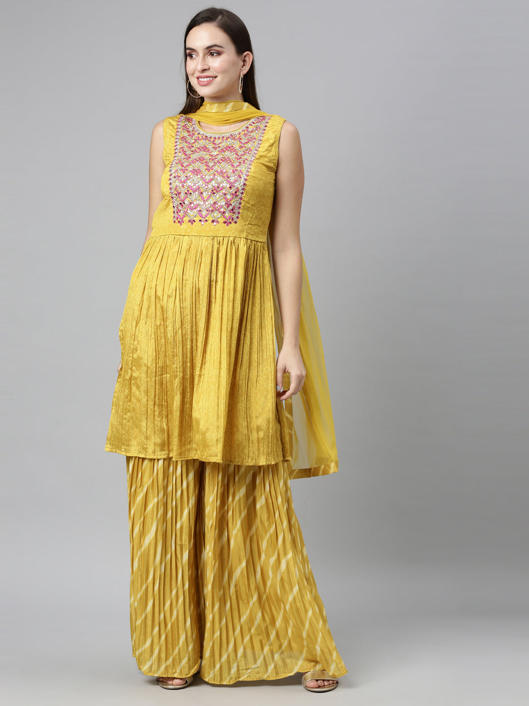 Neerus Yellow silk embroidered kurta set with sharara and dupatta - front view