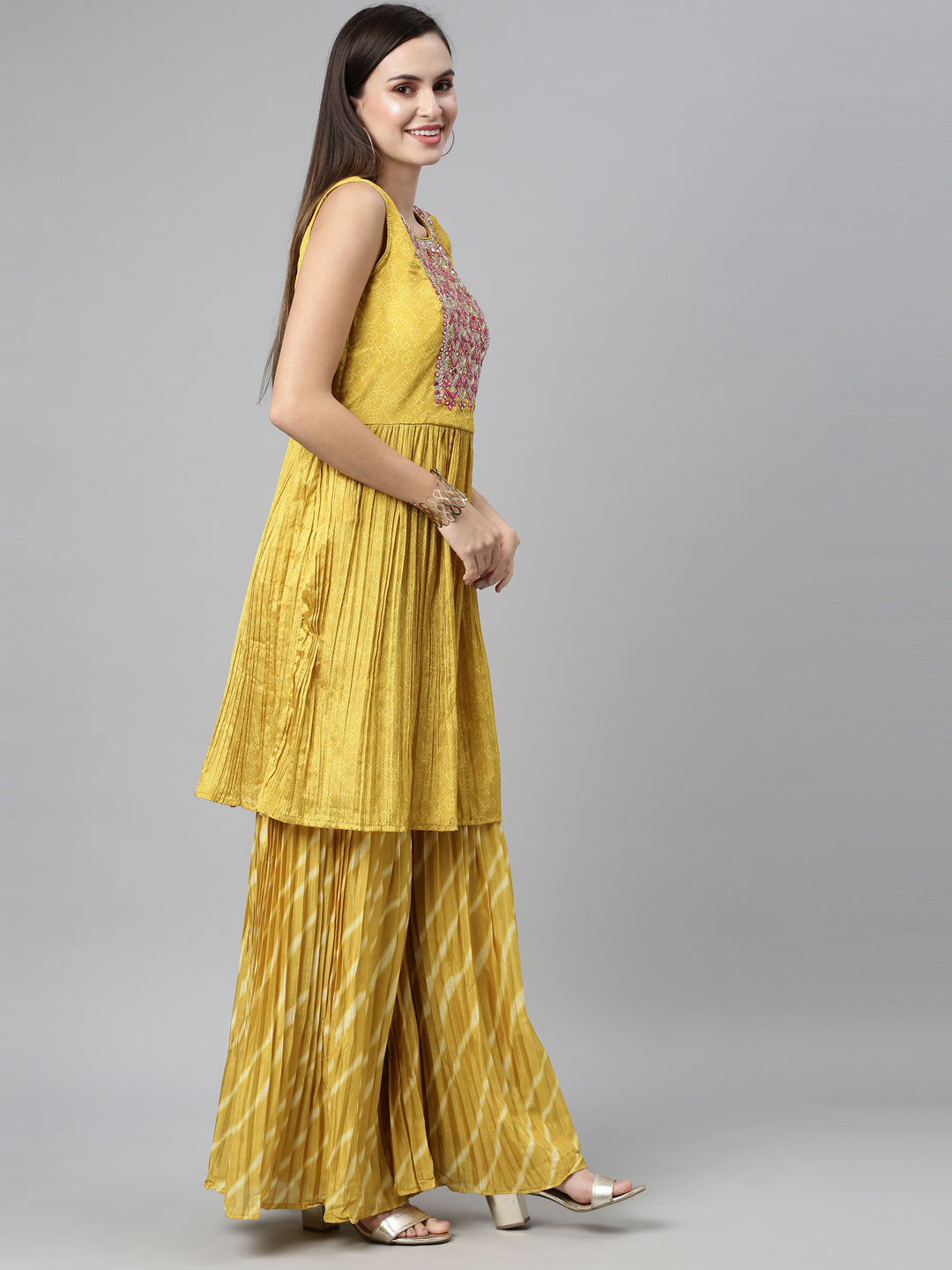 Neerus Yellow silk embroidered kurta set with sharara and dupatta - back view