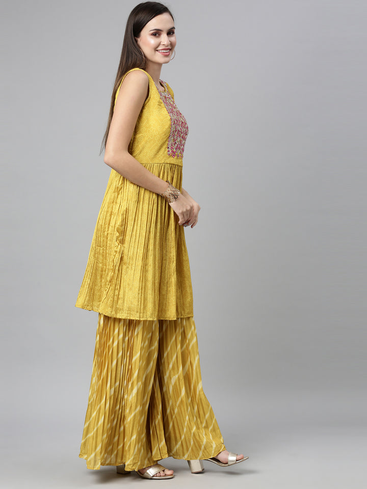 Neerus Yellow silk embroidered kurta set with sharara and dupatta - back view