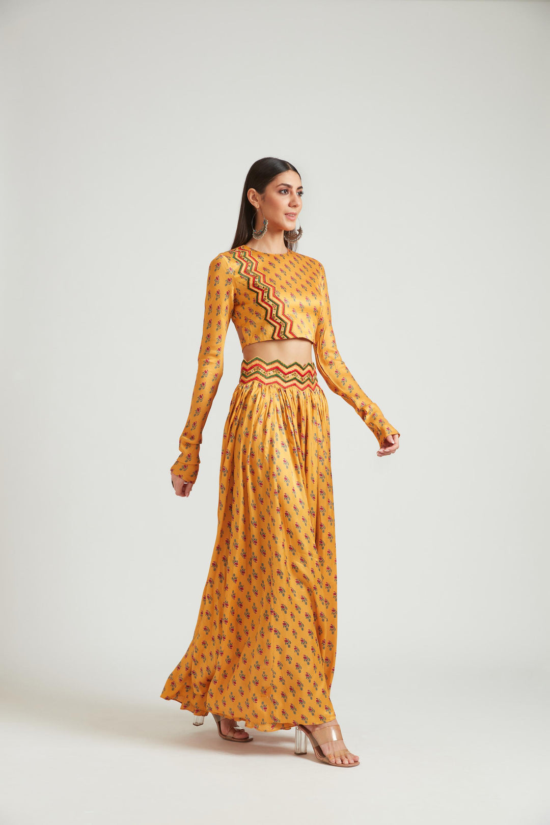 Neerus Yellow silk embellished lehenga choli set - back view