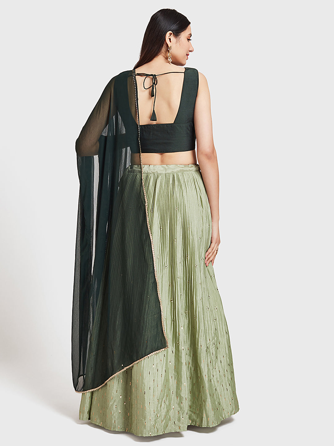 Neerus Green silk embroidered lehenga set - side view