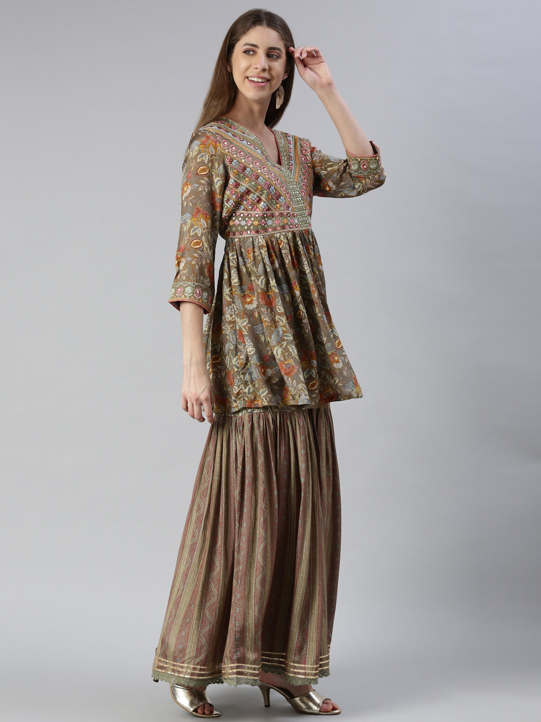 Neerus Green muslin embroidered kurta set with skirt and dupatta - back view