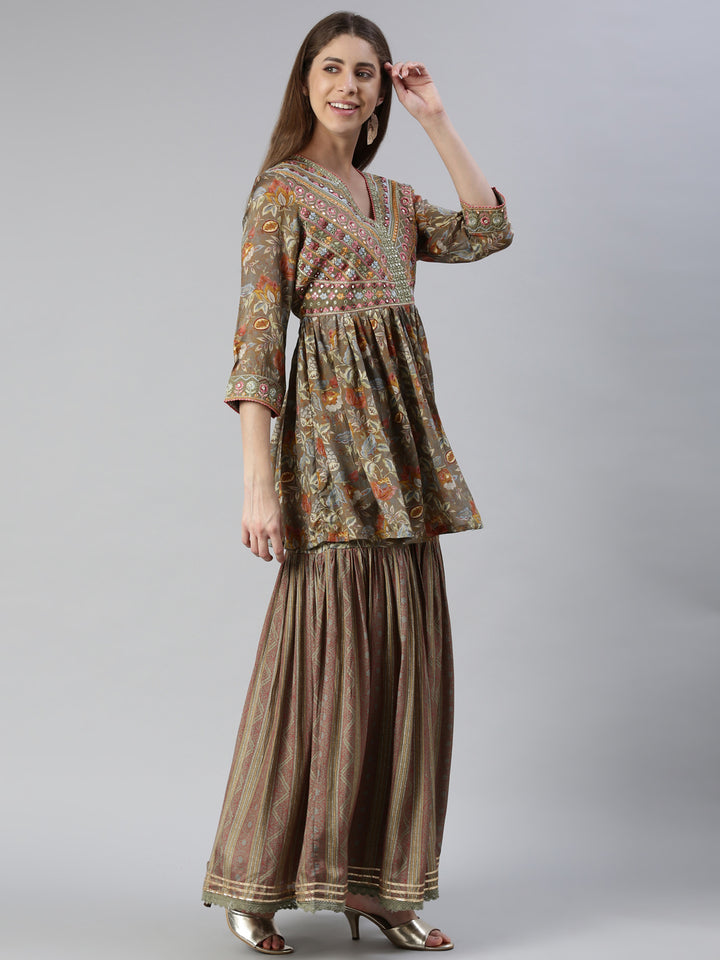 Neerus Green muslin embroidered kurta set with skirt and dupatta - back view