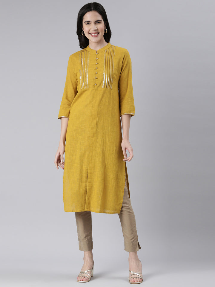Neerus Yellow cotton solid straight kurta - front view