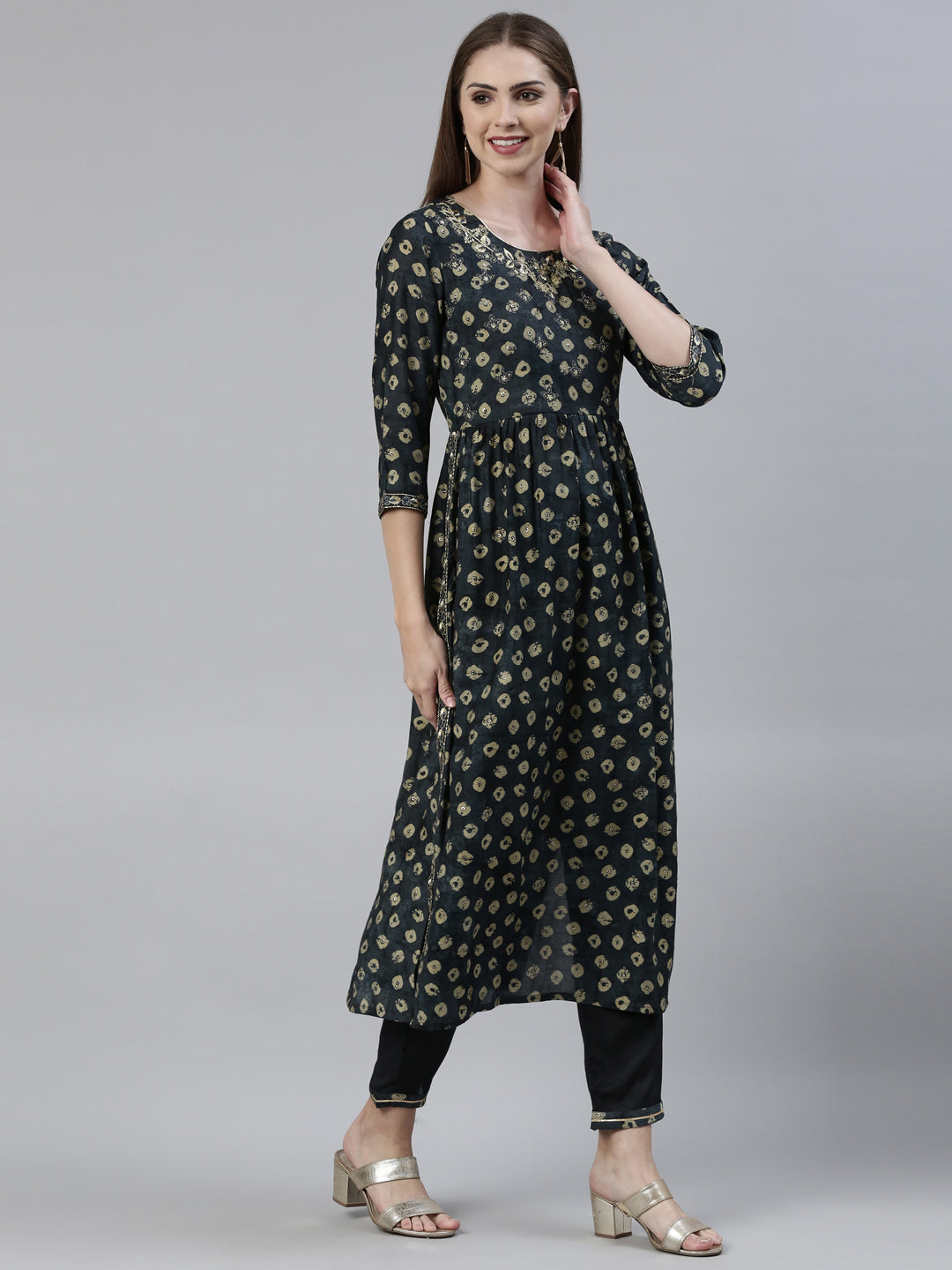 Neerus Green cotton printed kurta set with trouser and dupatta - back view