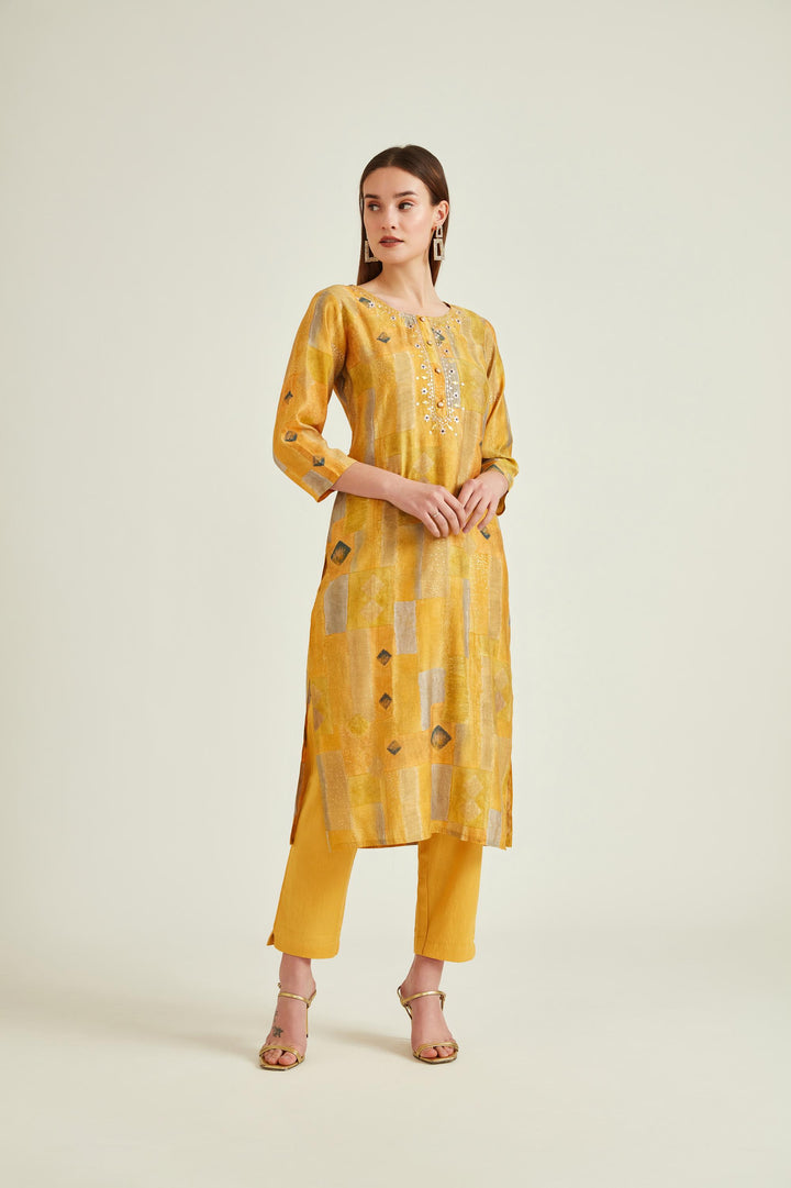Neerus Yellow muslin mirror work kurta set - front view