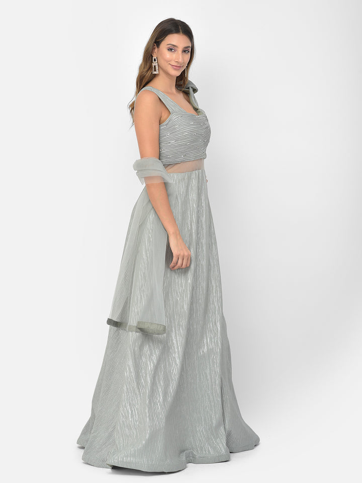 Neerus Green embellished flared gown - side view