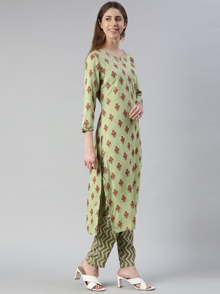 Neerus Women Pista Solid Calf Length Kurta And Trousers