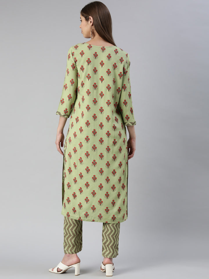 Neerus Women Pista Solid Calf Length Kurta And Trousers
