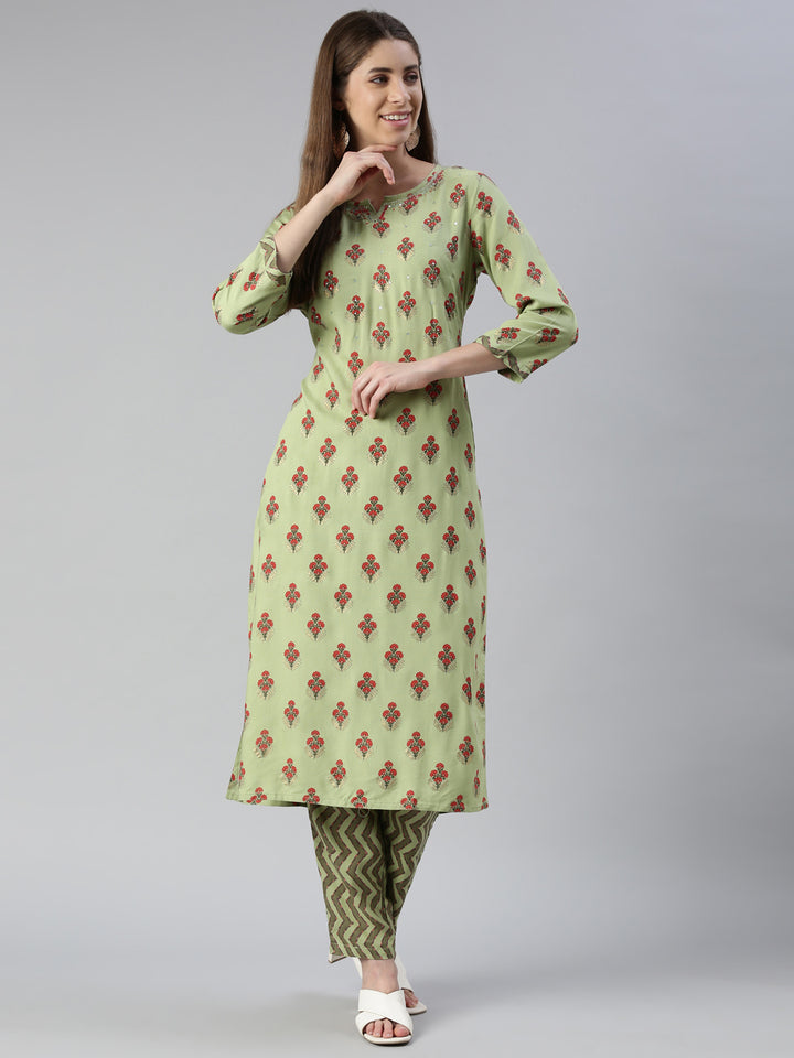 Neerus Women Pista Solid Calf Length Kurta And Trousers
