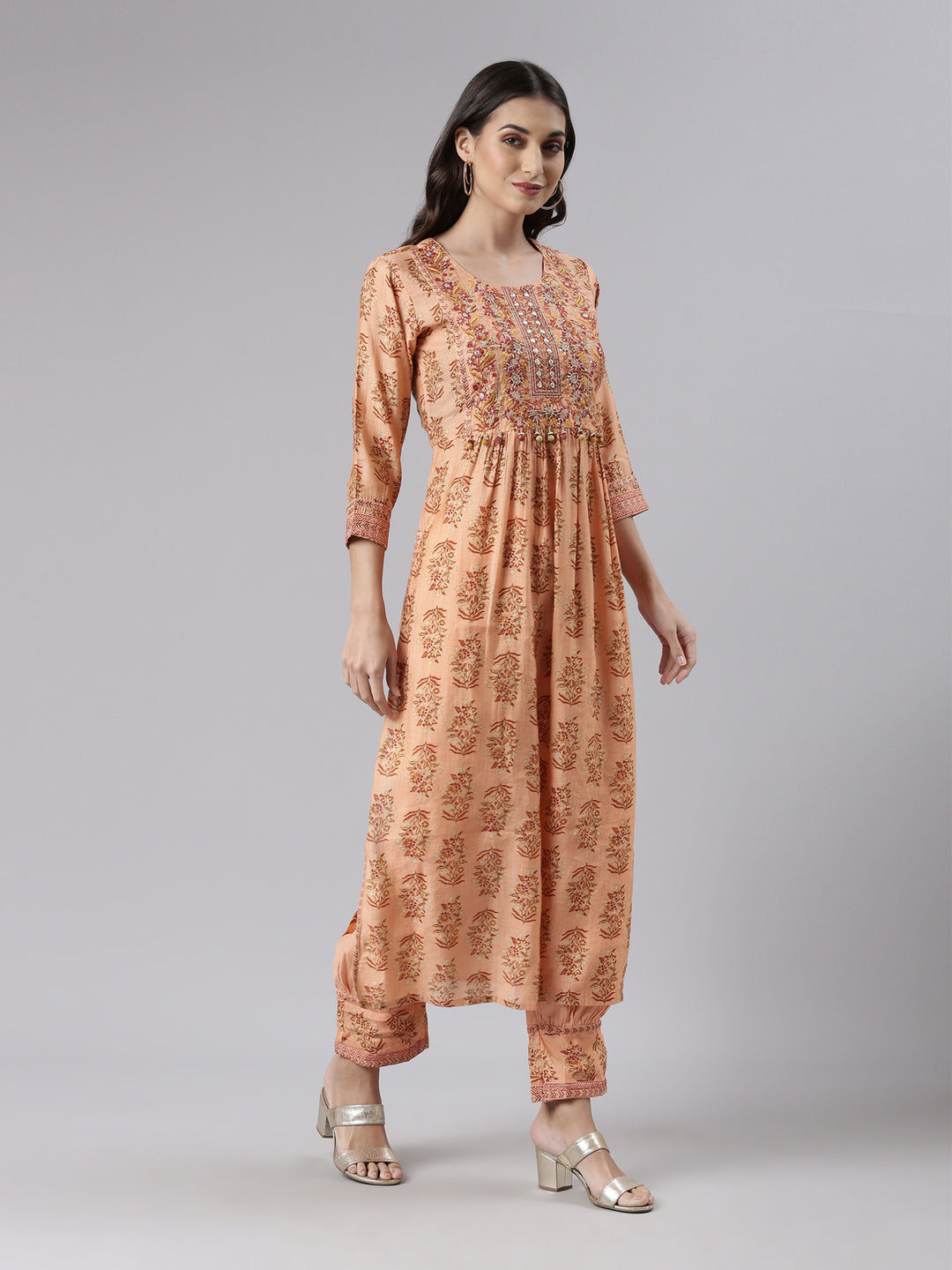 Neerus Orange printed kurta set with trouser and dupatta - back view