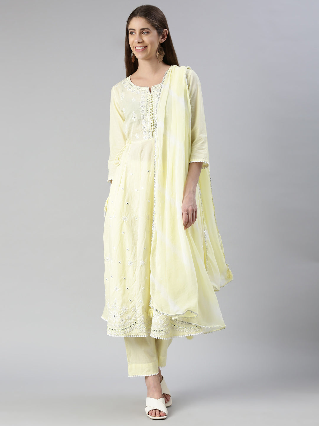 Neerus Yellow solid straight kurta set with trouser and dupatta - front view