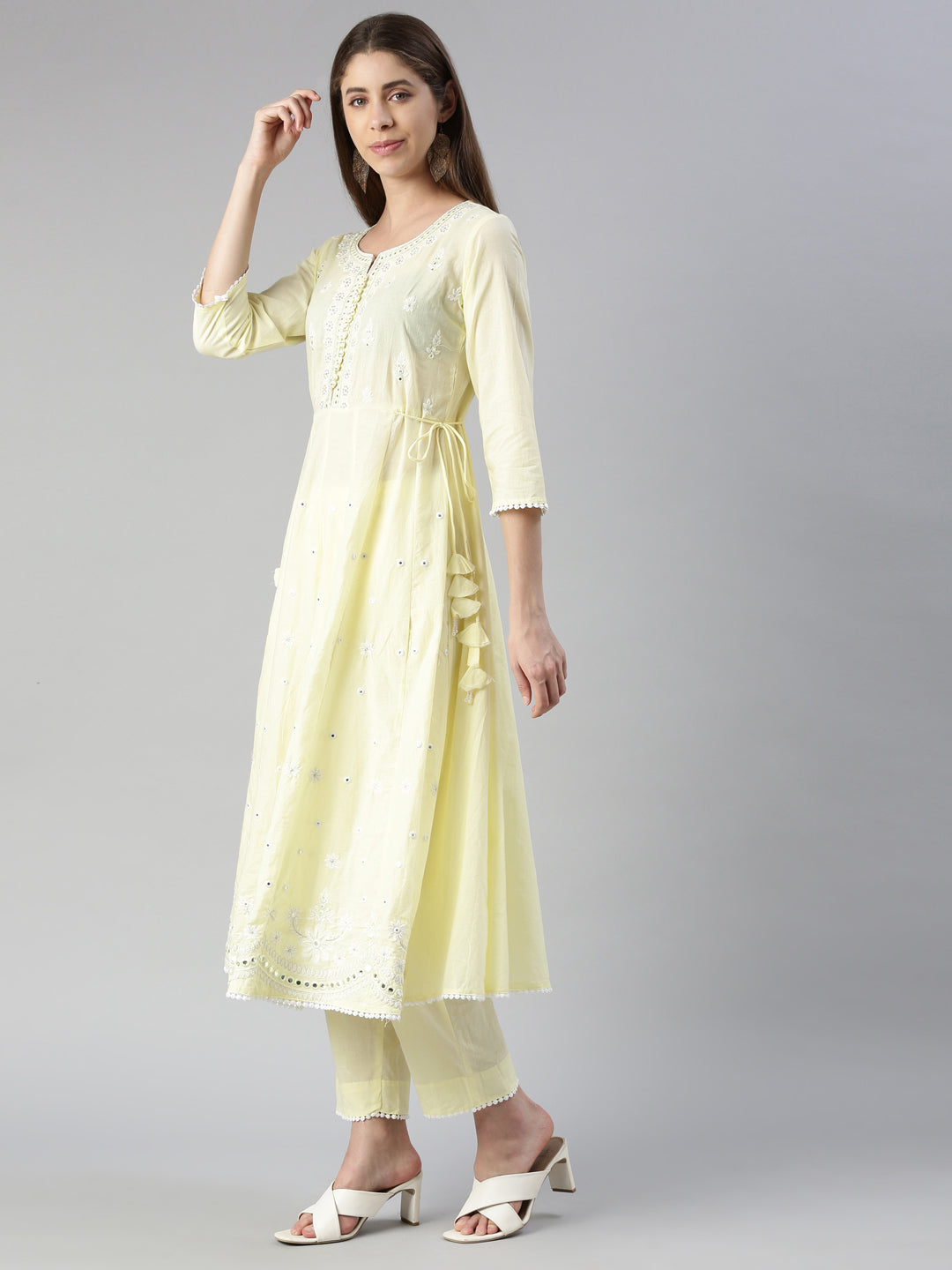 Neerus Yellow solid straight kurta set with trouser and dupatta - back view