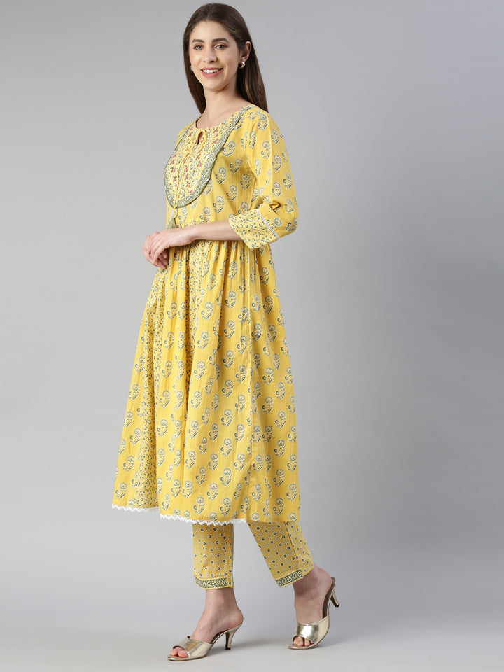 Neerus Yellow printed kurta set with trouser and dupatta - back view