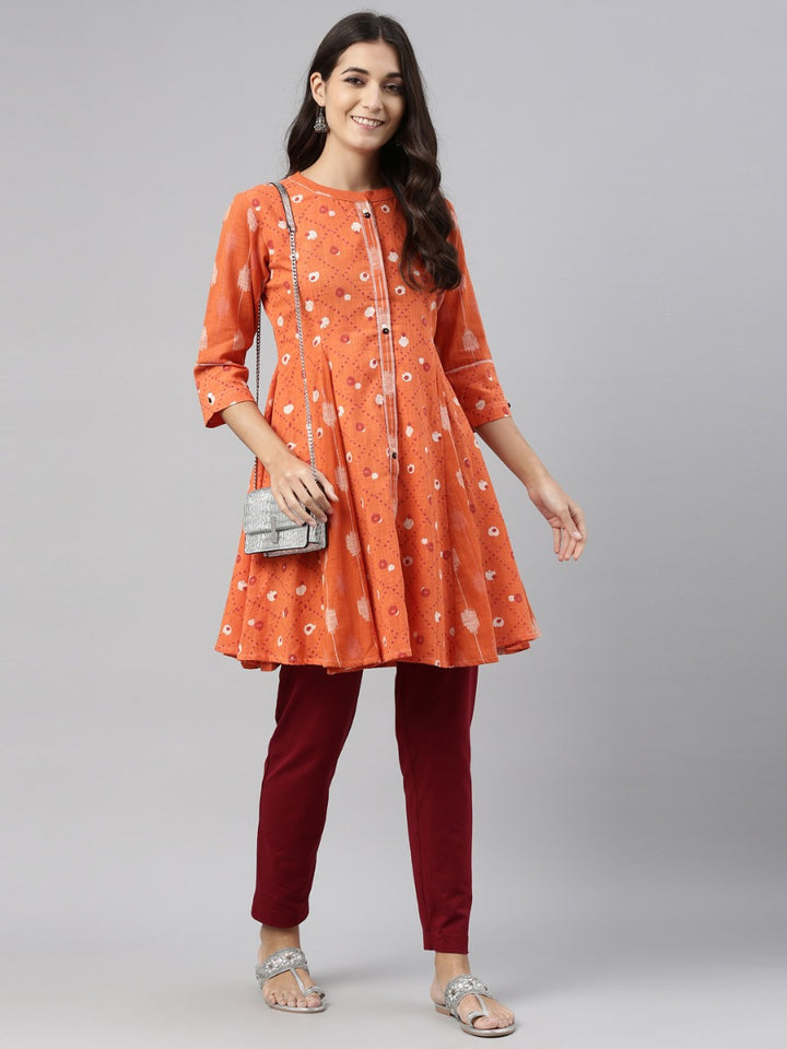 Neerus Orange cotton straight kurti tunic - front view