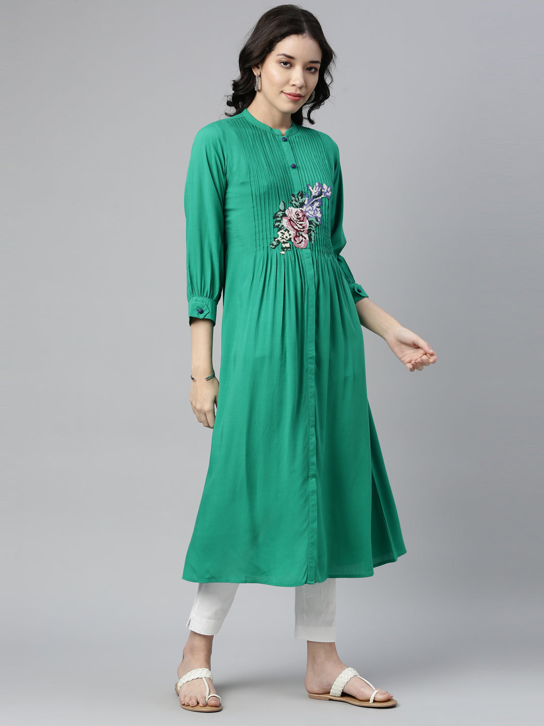 Neerus Green rayon panelled A-line kurti - front view