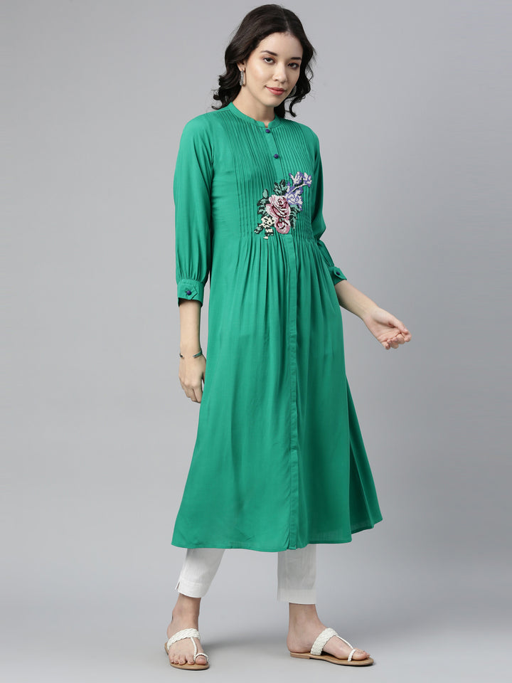 Neerus Green rayon panelled A-line kurti - front view