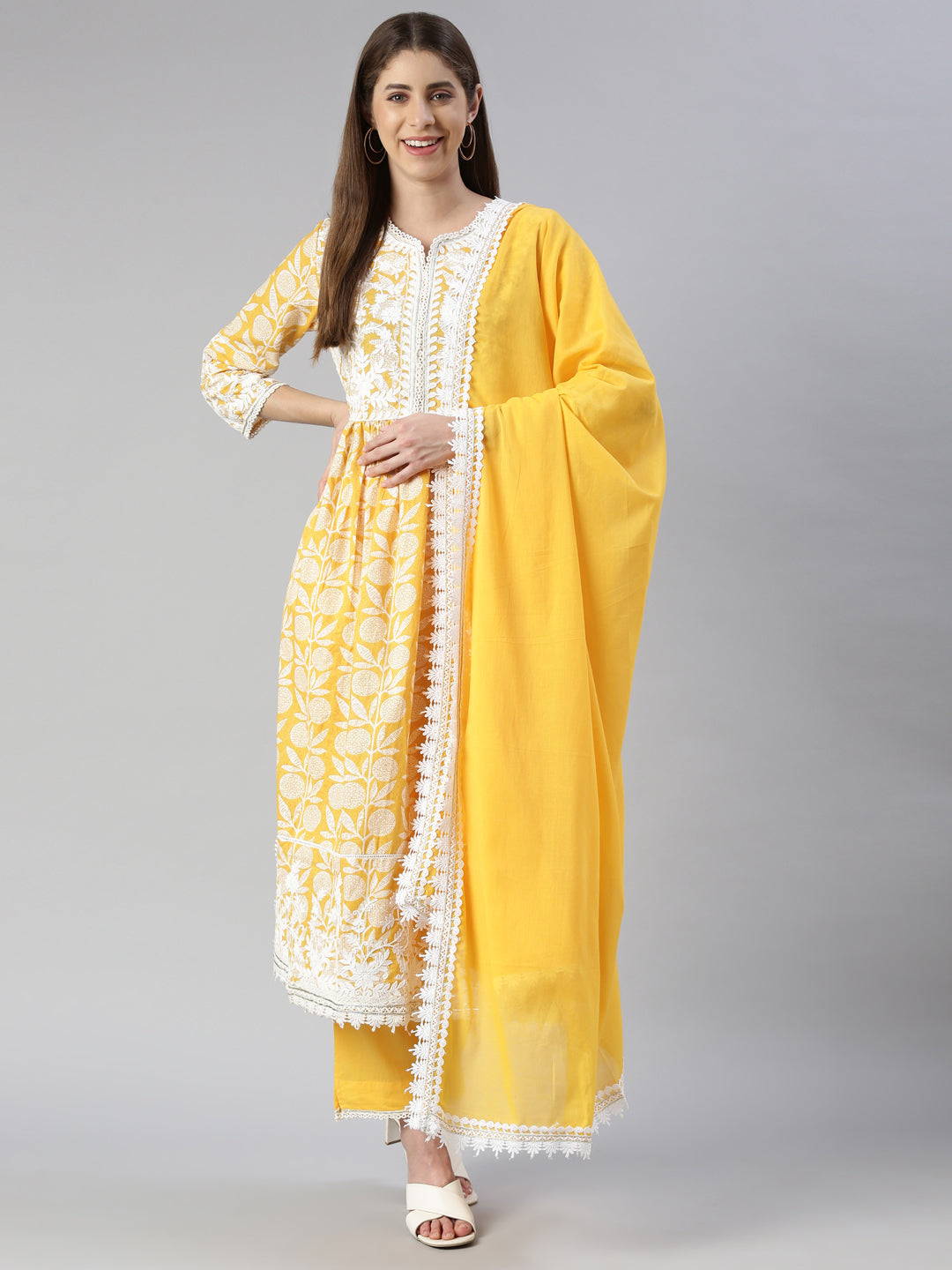 Neerus Women  Mustard Solid Calf Length Kurta And Trousers With Dupatta