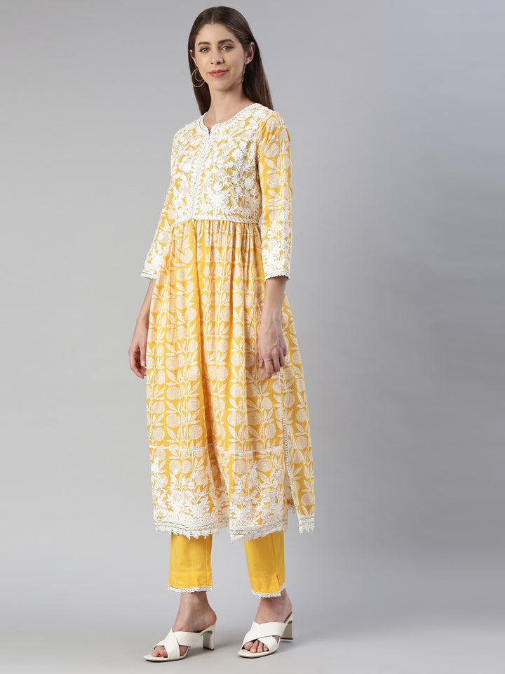 Neerus Women Mustard Solid Calf Length Kurta And Trousers With Dupatta